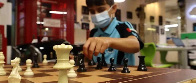 Student playing chess